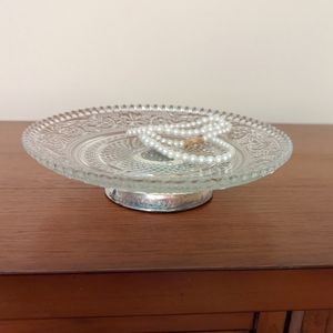 Vintage detailed etched glass catch all tray with silver base.